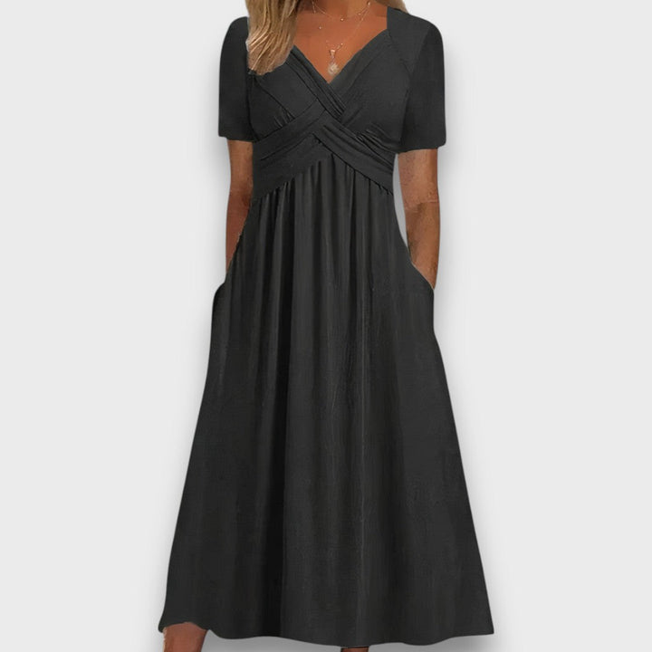 Enyelle – Dress with Delicate Wrap Look